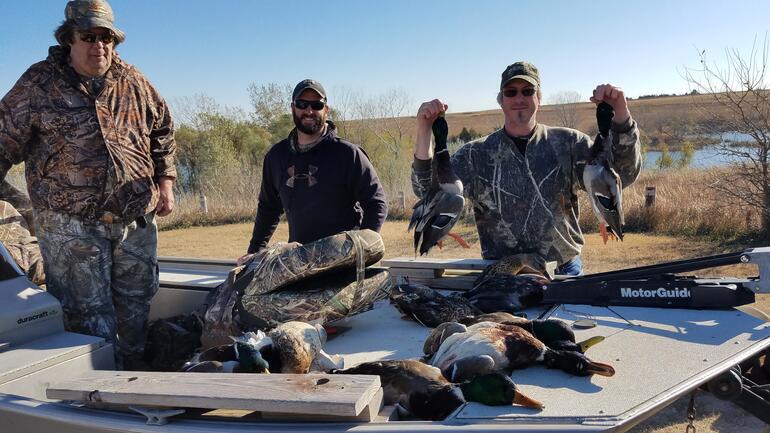 3 duck hunters posing with their harvest 2020