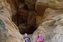 Kids enjoying the Slide Cave on the Buffalo Tracks Canyon Nature Trail at Kanopolis State Park